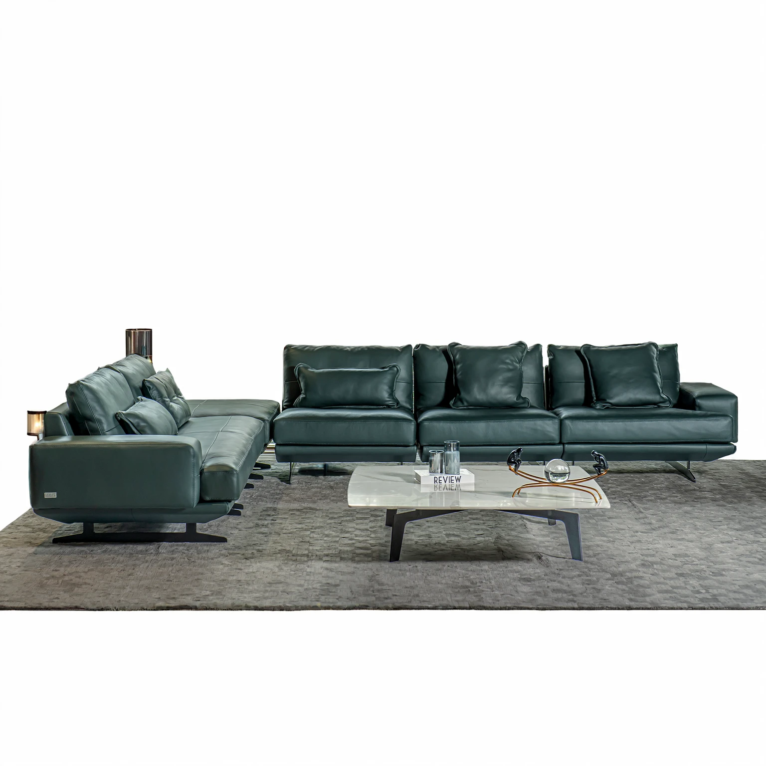 Design a luxurious and modern living room with high ceilings and a sophisticated aesthetic. The room features a large sectional sofa with a mix of neutral and dark pillows, a stylish round coffee table, and a sleek entertainment center with built-in shelving. The space is illuminated by elegant circular pendant lights hanging from the ceiling. Large floor-to-ceiling windows allow natural light to flood the room, highlighting the contemporary decor and creating an inviting atmosphere. Add a few decorative items and books on the shelves to enhance the sophisticated feel.