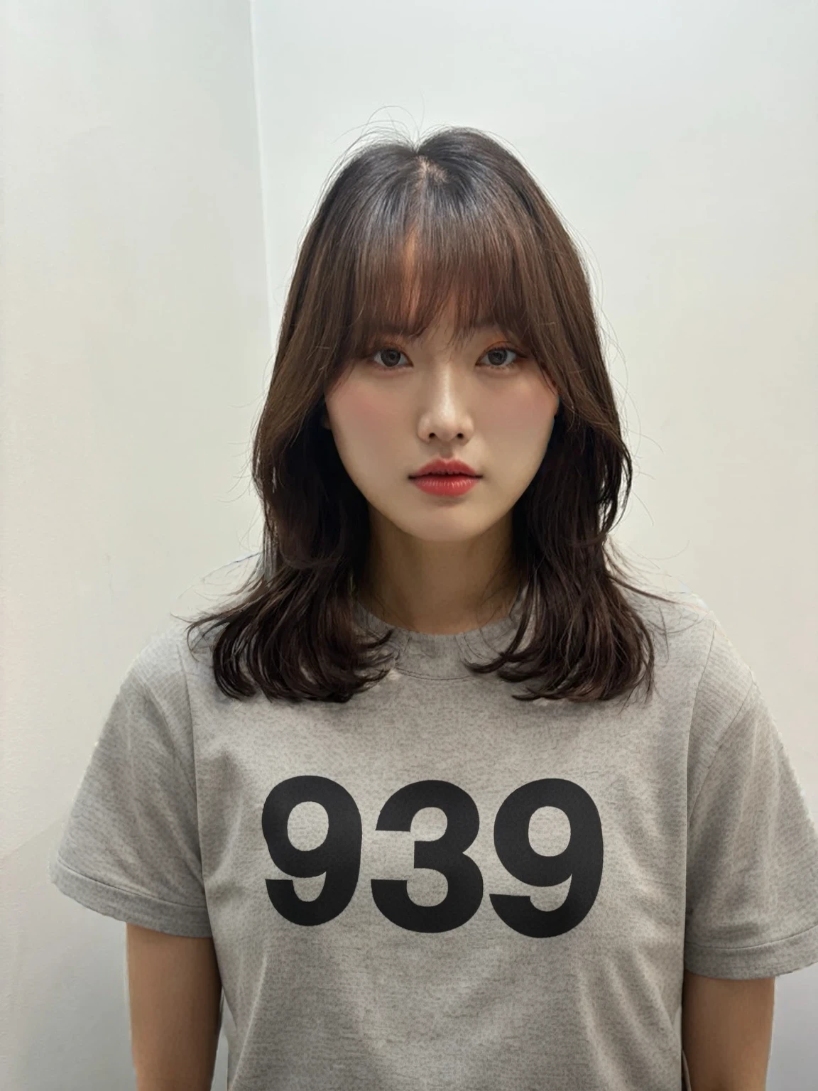 Best Quality, 8k, Masterpiece, (Portrait: 1.3), (photo realistic:1.4), (hyper realistic:1.4), Sharp Focus, looking at viewer, (smoother lighting:1.1), (increase cinematic lighting quality:0.9), realistic lighting, backlighting, light on face, ray trace, (brightening light:1.2), (Increase quality:1.4), sharp detail, (best quality real texture skin:1.4), finely detailed eyes, black_eyes, finely detailed face, 25 year old Korean woman, (GRAY formal_shirt:1.4), (Create an image maintaining the original base model hairstyle:1.5)