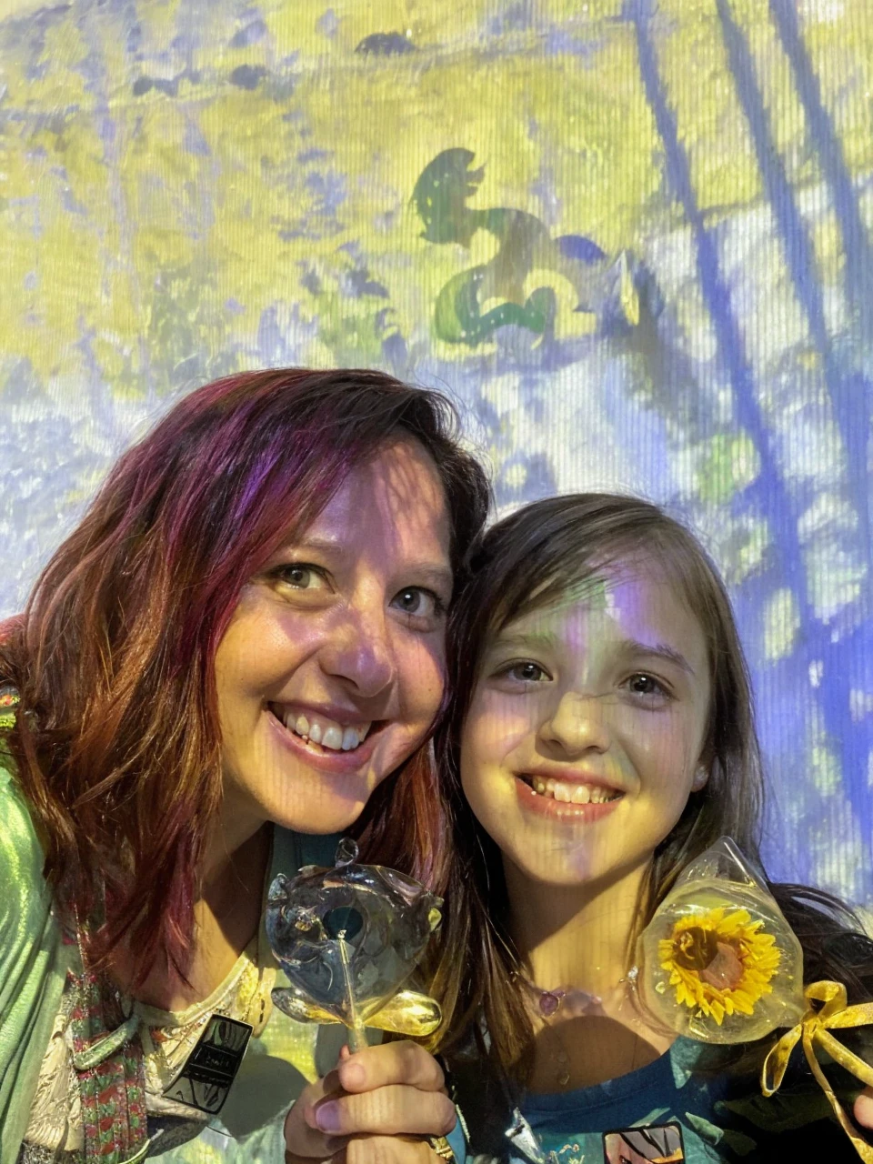 “Cover art for a children’s book titled ‘The Starry Adventures of Quin and Pickles the Dinosaur: Quin, Pickles, and Memaw’s Time-Travel Adventure.’ The cover should depict a young girl, Quin, lying in her bed, holding a stuffed dinosaur, Pickles. Both are wearing glowing Dream Necklaces. Above them, a dream world is illustrated with a lush green meadow under a twilight sky, a shimmering portal, and Memaw with a glowing necklace. They step through the portal into a quaint valley with wildflowers, a gentle stream, and a baby dinosaur. The scene is magical and inviting, with a sense of warmth and adventure.”