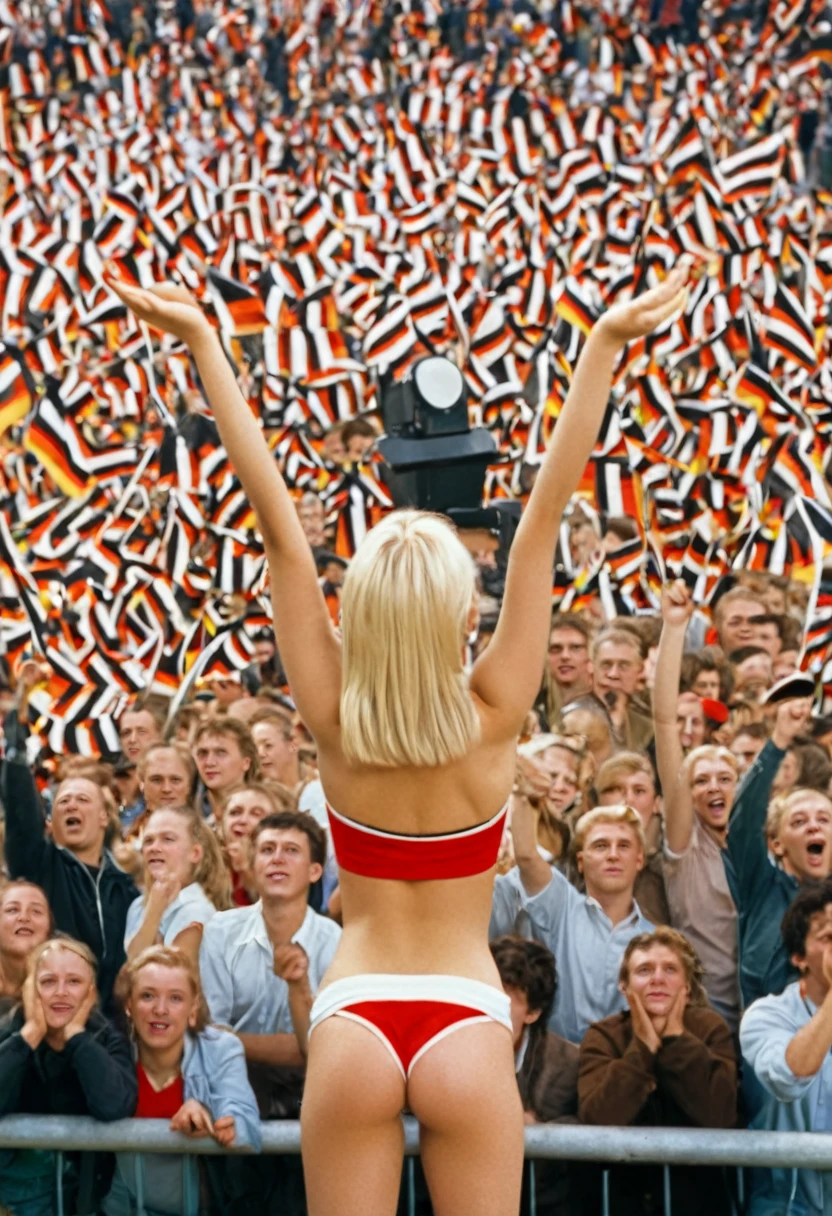 a blonde young woman, A wide shot, with a cheering crowd in the background, german public viewing