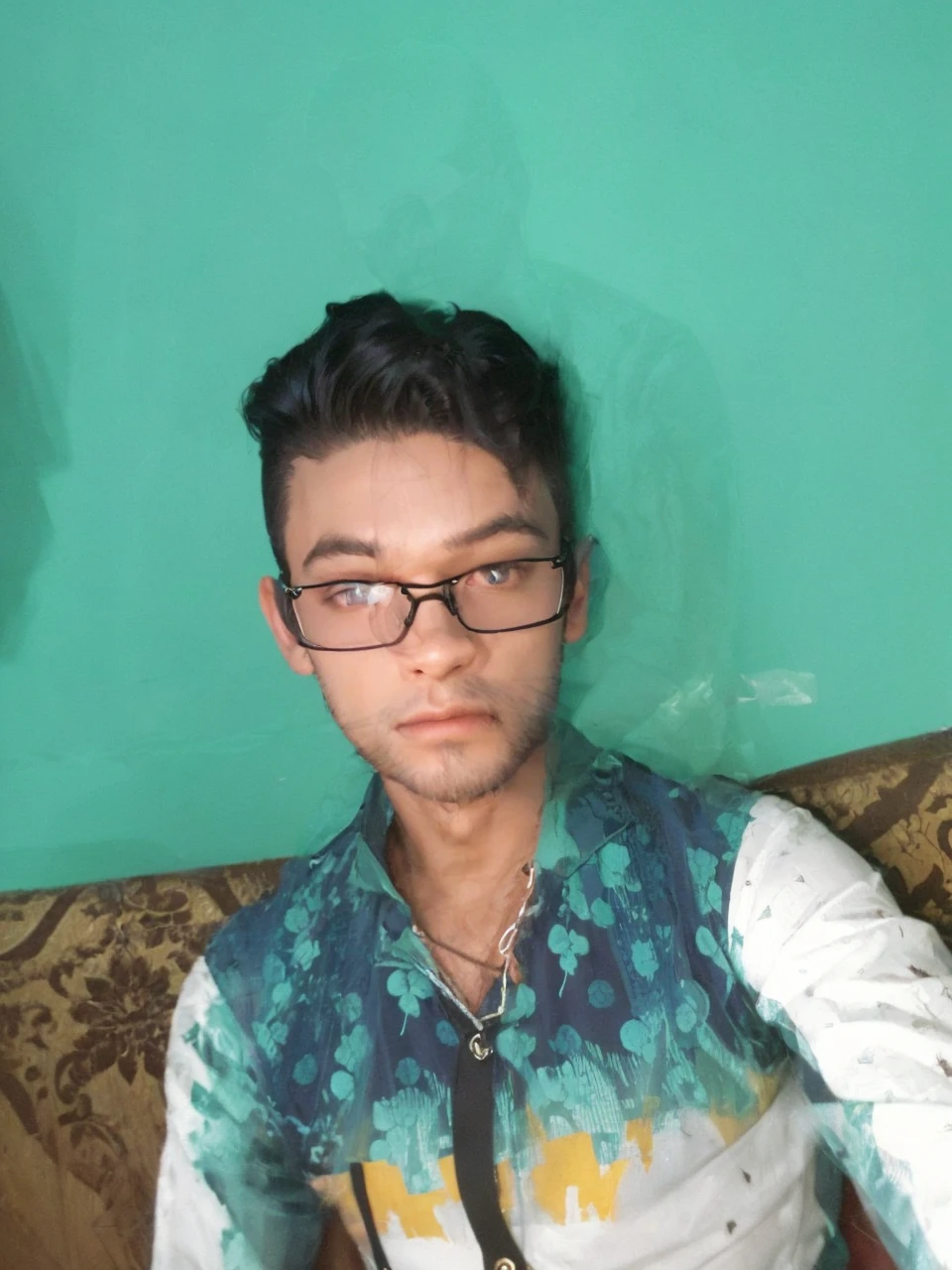 a handsome 22 years old male vampire hunter with ponytail black hair with short beard, pale skin, serious looking, wearing a red and black casual outfit and black pants, waist up shot, dynamic pose, ambient lighting, photo realism, intricate face detail, intricate hand details, highly detailed, vibrant colors, cinematic, high definition, trending on Artstation-style raw
