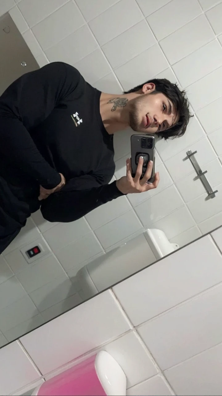 a young handsome man,short dark straight hair,bangs,anxious expression,muscular build,detailed facial features,realistic,photorealistic,high resolution,8k,best quality,masterpiece,vivid colors,dramatic lighting,cinematic composition