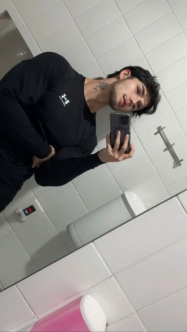 a young handsome man,short dark straight hair,bangs,anxious expression,muscular build,detailed facial features,realistic,photorealistic,high resolution,8k,best quality,masterpiece,vivid colors,dramatic lighting,cinematic composition