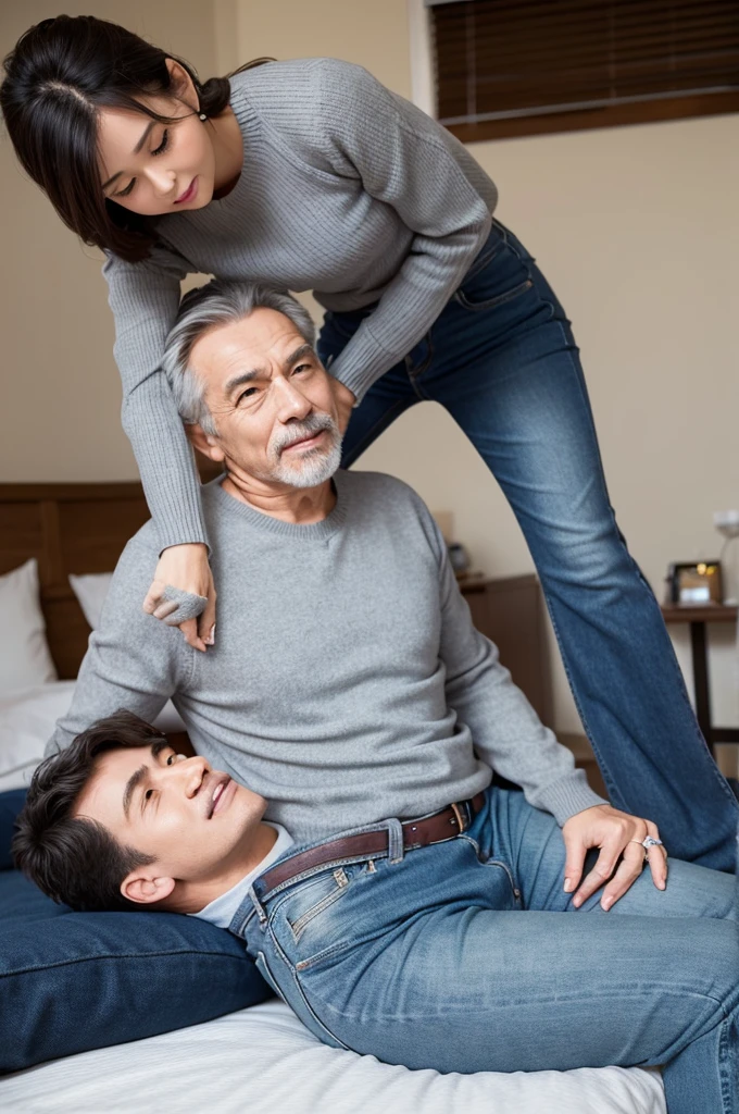 On the bed、A woman wearing a tight grey sweater and jeans sits on an older man's lap and hugs him.