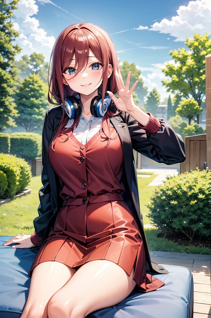 Miku Nakano sitting on the sofa looking at me with a smile and waving