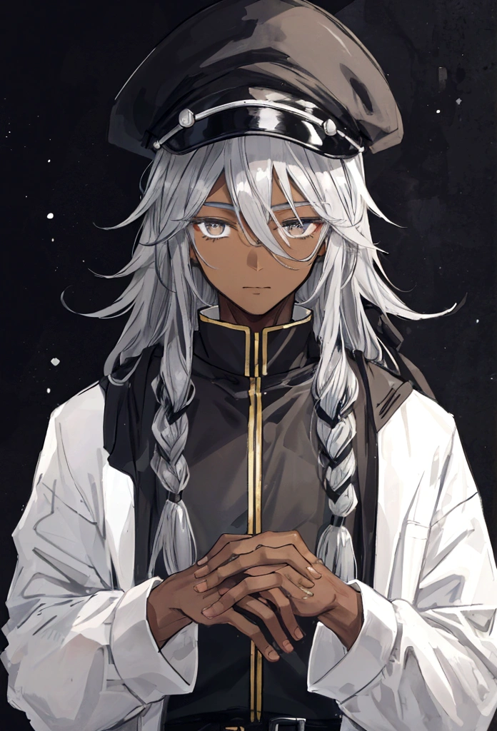 a black man with locks and a grey cap