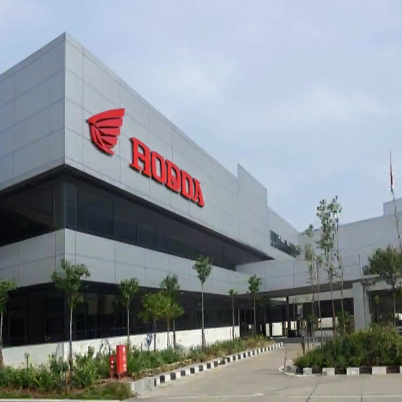 a close up of a building with a honda logo on it, inspired by Hiroshi Honda, leaked image, ishirō honda, “wide shot, repsol honda, profile photo, taken with sony alpha 9, by Daniel Lieske, by Hiroshi Honda, hongbsws, trending photo, modern technology building, honda civic, exterior shot