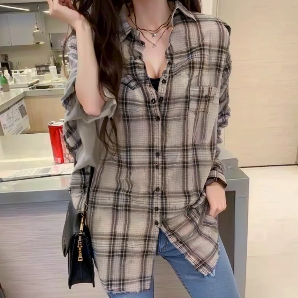 arafed woman in a plaid shirt and jeans posing for a picture, plaid shirt, long shirt, flannel, wearing a flannel shirt, shirt, wearing plaid shirt, wearing a plaid shirt, 2020 Fashion, A loose fitting blouse, Extra Large, wearing in shirt, 🤬 🤮 💕 🎀, 19xx, brown shirt, stylish, Exclusive