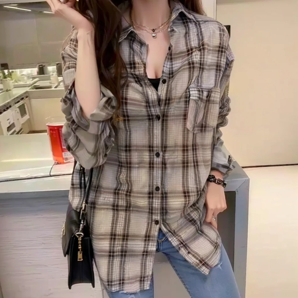 arafed woman in a plaid shirt and jeans posing for a picture, plaid shirt, long shirt, flannel, wearing a flannel shirt, shirt, wearing plaid shirt, wearing a plaid shirt, 2020 Fashion, A loose fitting blouse, Extra Large, wearing in shirt, 🤬 🤮 💕 🎀, 19xx, brown shirt, stylish, Exclusive