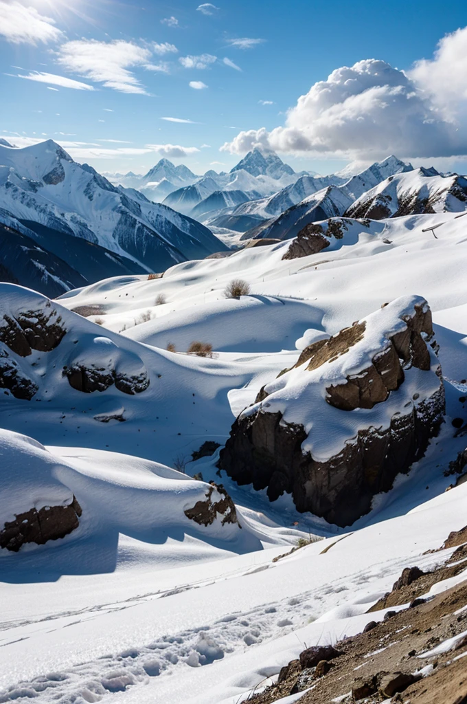 The Himalayas are covered with snow and clouds above them
