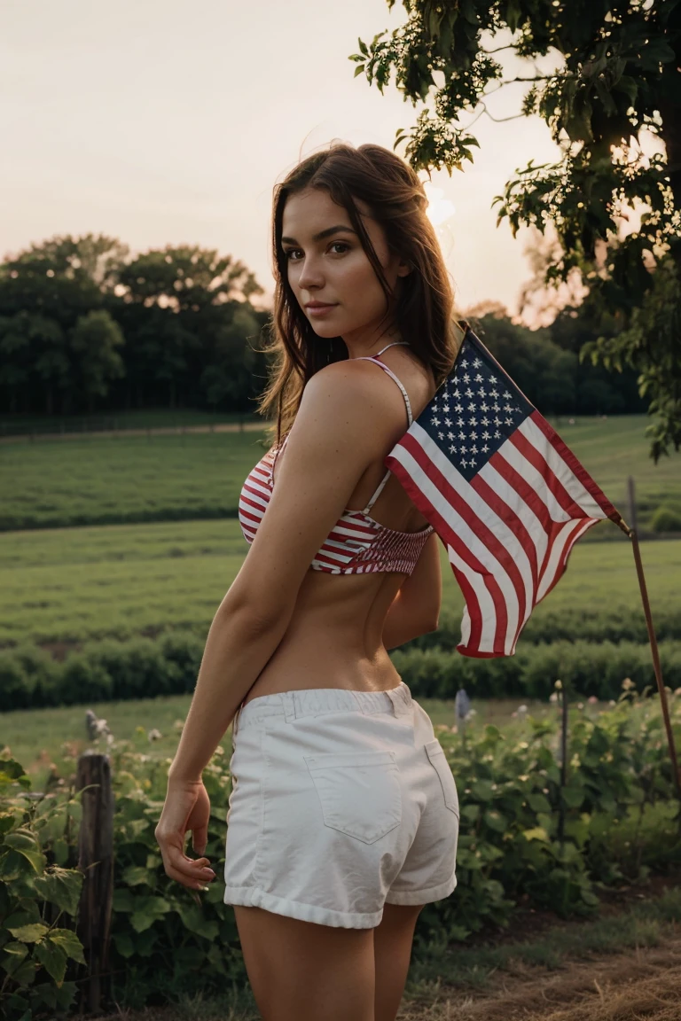 Beautiful woman on the farm, holding american flag, fourth of july, sexy