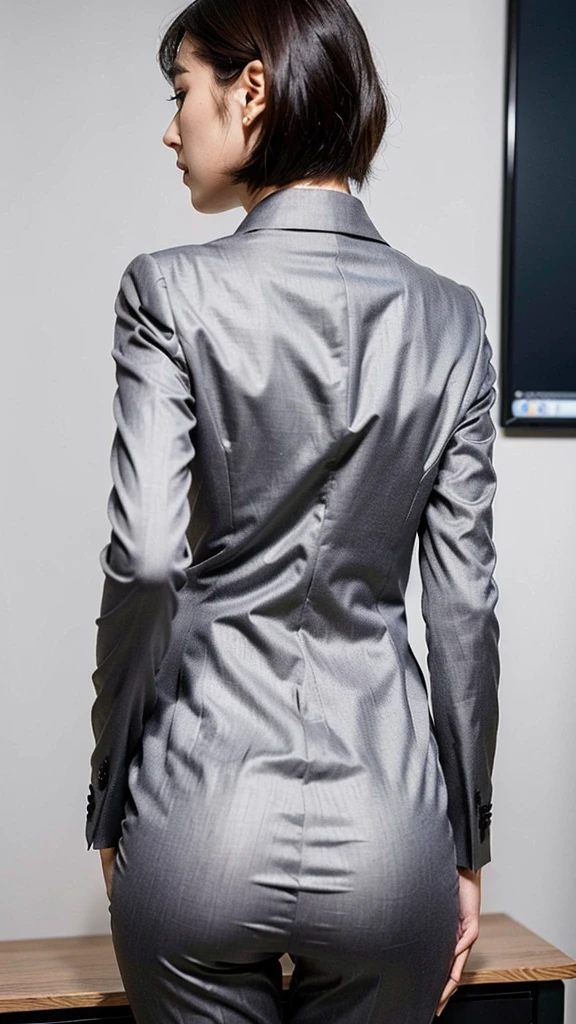 (Best quality, 8k, 32k, Masterpiece, UHD:1.2), 1girl, beautiy Japanese woman, narrow waist, grey suit, open jacket, office lady, suit, pants, from behind, office room, desk,  (stick out one's buttocks:1.2), detailed face, short hair, looking at viewer
