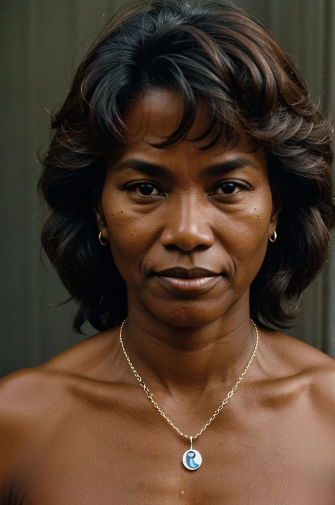 photograph of a 57-year-old woman of color, round face nose answered, muscular, a mole on his left cheek with a Christian necklace around his neck in New York, 1979