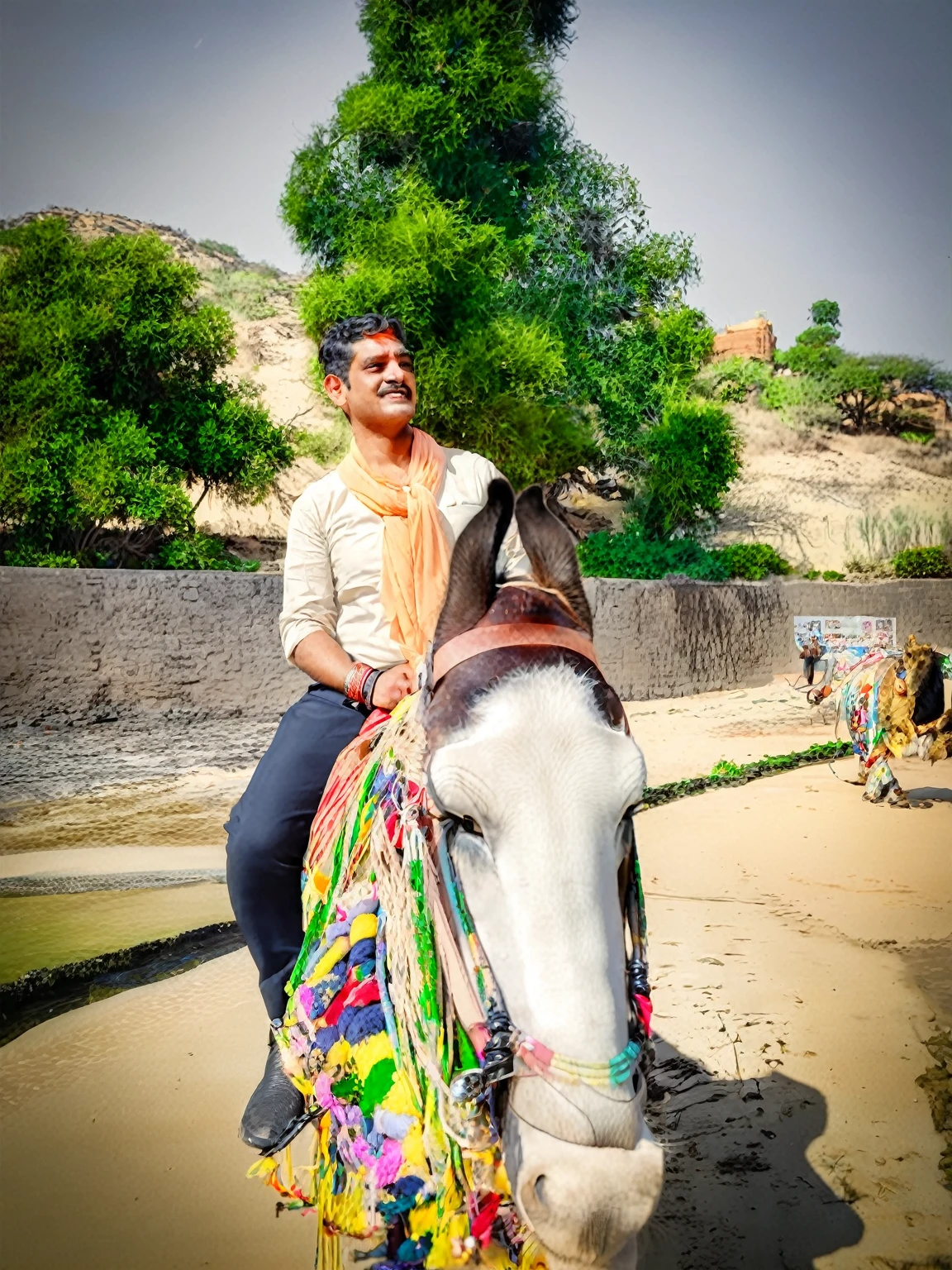 there is a man riding a lion on the beach, with lion driven, on a lion, ride lion, riding a lion, riding lion, dressed in a jodhpuri suit, riding a lion!!! in saharan, taken with sony alpha 9, ride lion in saharan, lion rider, lion in background, riding a lion, guy with lion head, lion on top