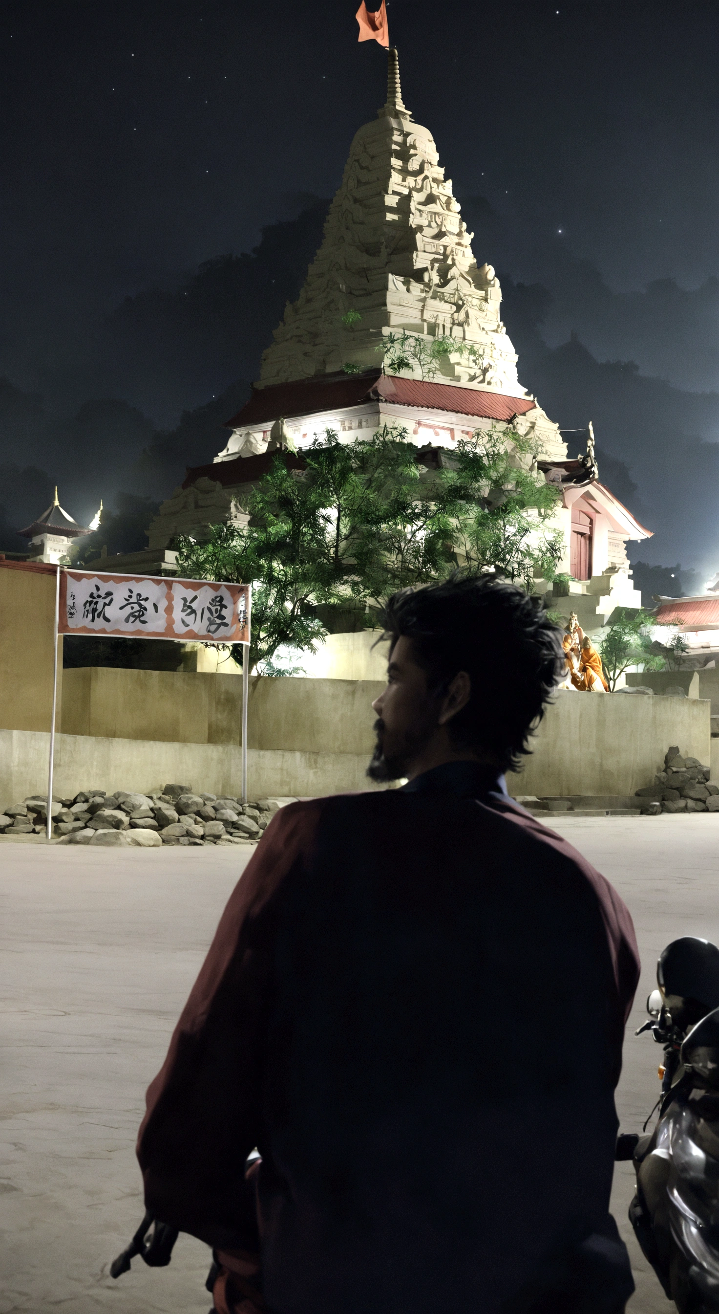 there is a man sitting on a motorcycle in front of a building, in front of the temple, temple in the background, in front of a temple, at night time, a temple, temple, hindu temple in background, glowing temple in the distance, during night, taken in the night, temple background, night view, photo taken at night, buzzed hair on temple
