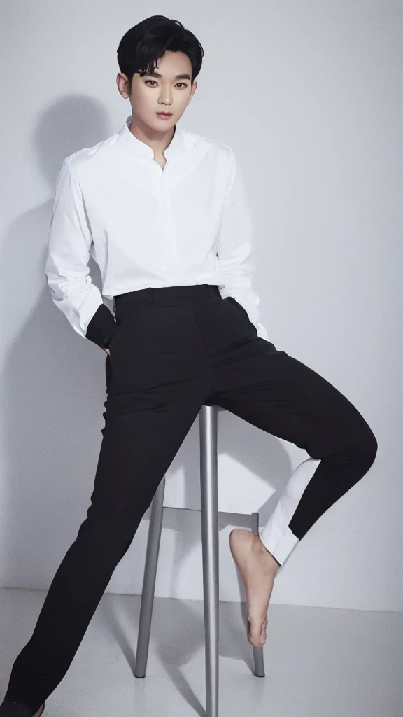 Asian guy, 25 years old, black hair, long-sleeved white shirt, pants, sitting at the desk, looking at the camera.