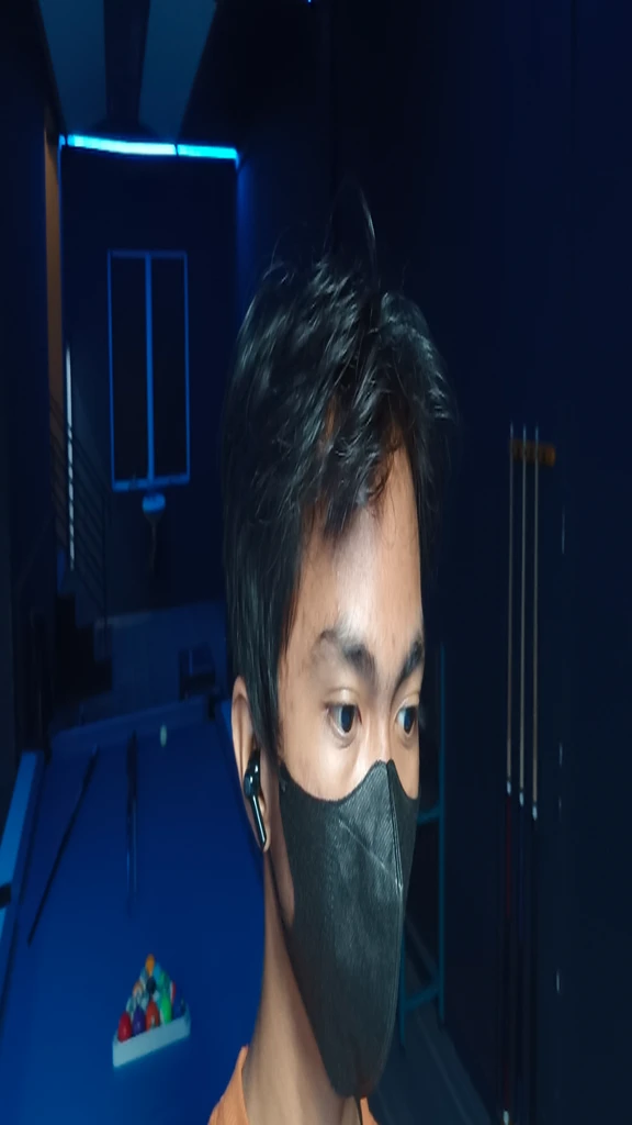 there is a man wearing a mask in a room with pool tables, wearing all black mempo mask. Handsome, realistic