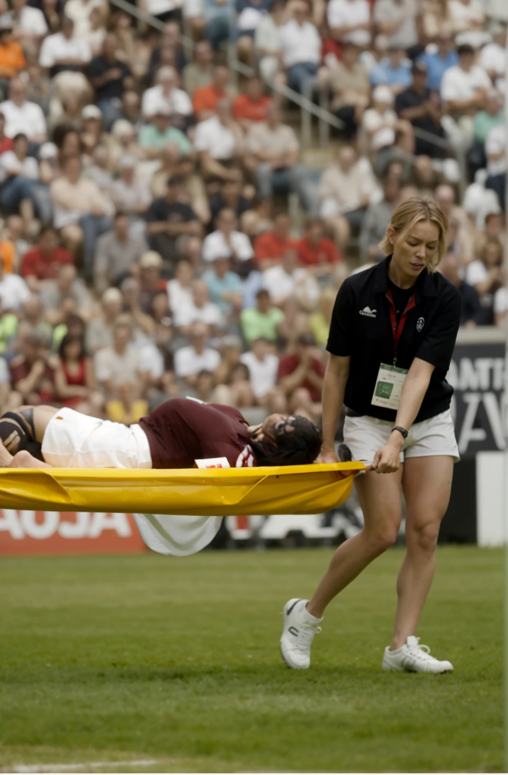 a blond woman is carrying a astretcher on a soccer field, there is a male soccer player in short sportswear lying injured on a stretcher, there is an injured sportsman who is covering his face on a stretcher, an injured sportsman is covering his face with his hands, an injured sportsman is writhing ecstatic in pain on a stretcher, dramatic pity pose, there is a very female woman in a high-shine coat, a high-shine black wetlook coat, a long shiny coat, a wetlook glossy coat, a wet black laquered coat, a very female looking wife is wearing a wetlook coat, injured, medic, soccer action pose, affection pose, lecherous action pose, dramatic action pose, theatralic pose, there is an attractive woman that is carrying a suffering man on a stretcher, there is a beautiful woman in a shiny coat who is carrying a blond man on a wet orange stretcher, a longhaired beautiful woman in a high-shine coat, a longhaired woman in a shiny downcoat, a woman is carrying a stretcher with a shorthaired man who is wearing shorts and a t-shirt, a weak man in spots shorts is consciousless and needs to be carried on a wetlook pvc stretcher, a shorthaired man with closed eyes is carried on a stretcher by a longhaired woman, a woman looks very scared and terrified, a consciousless man with closed eyes is suffering very much and has a very painful face, photo, photo shoot, photographed , accident, help, aid, first aid, pity