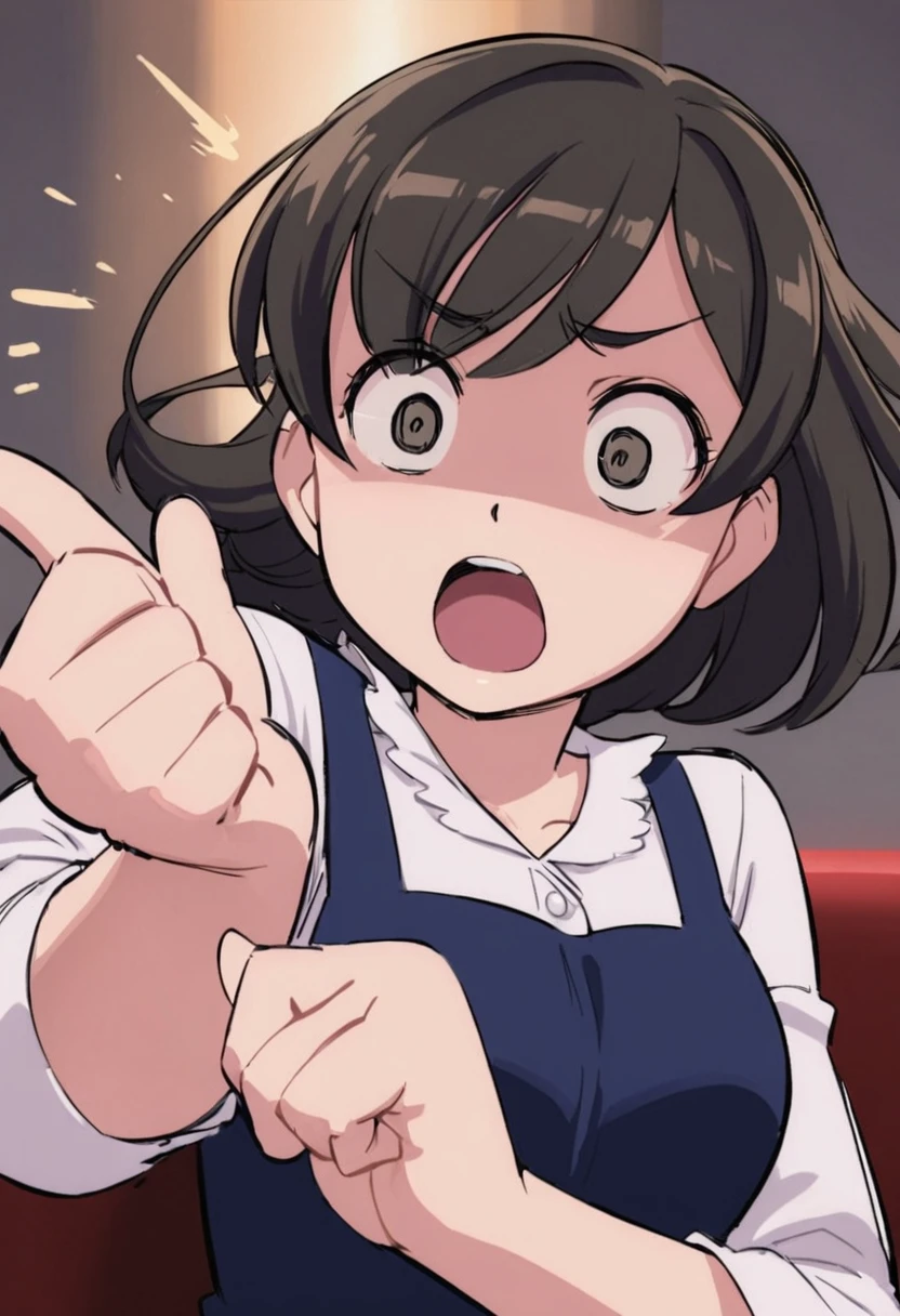 Woman pointing at something in her hand with surprised face with short hair looking at herself from half body up