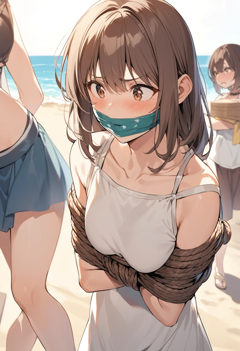 A fearful mother and a daughter with brown hair bound and gagged together at the beach