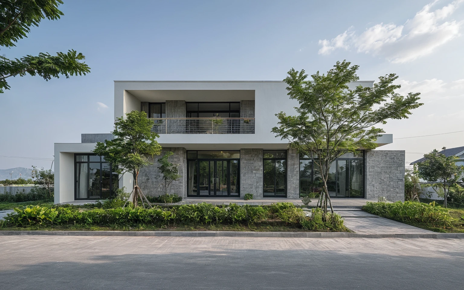 Raw photo, Masterpiece, high quality, best quality, authentic, high realistic, super detail, Realistic green tree exterior, outdoors, Tuonghoagio, house, modern stytle, on the street, wind flower wall, glass windows, GRAY STONE wall, GRAY metal gate, metal railing, house style modern on the street road, pavement, grass, trees, sky, cloud, (daylight:1.1)