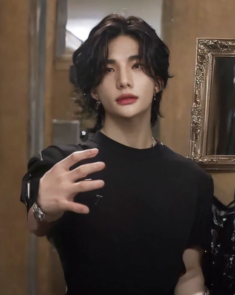 HYUNJIN HWANG, black wavy hair, highlighted cheekbones, thick lips, iris grises, slanted eyes.