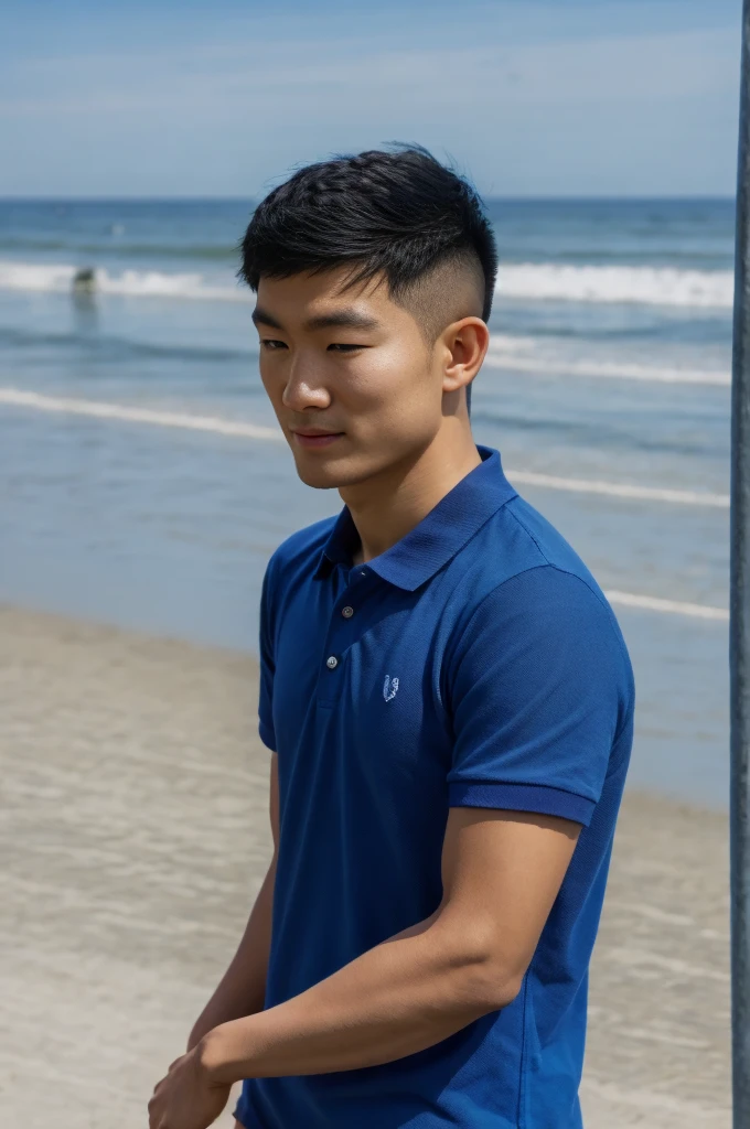 young asian man in a blue polo shirt , seaside beach sunshine looking at the sea