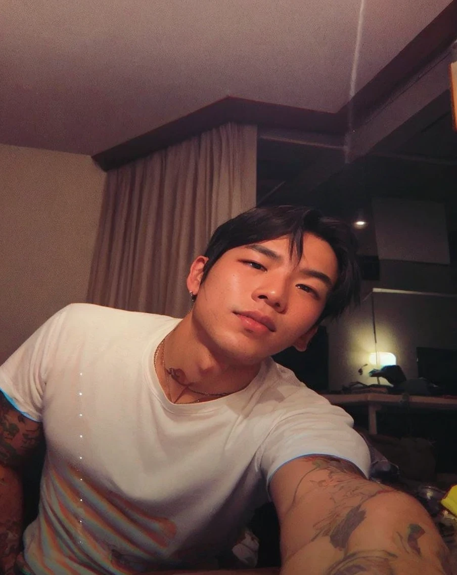 Asian boy in a dark room