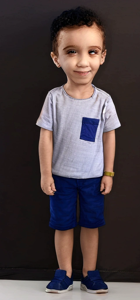 Treatment, solo boy in casual outfit school background, boy standing looking at camera and smiling, wall with alphabet