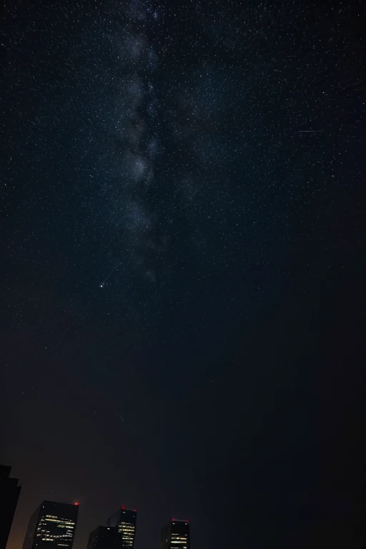 Photo of a dark night sky taken by a cell phone, with few buildings present. The photo must be taken from bottom to top, as if the person who took it was walking around town