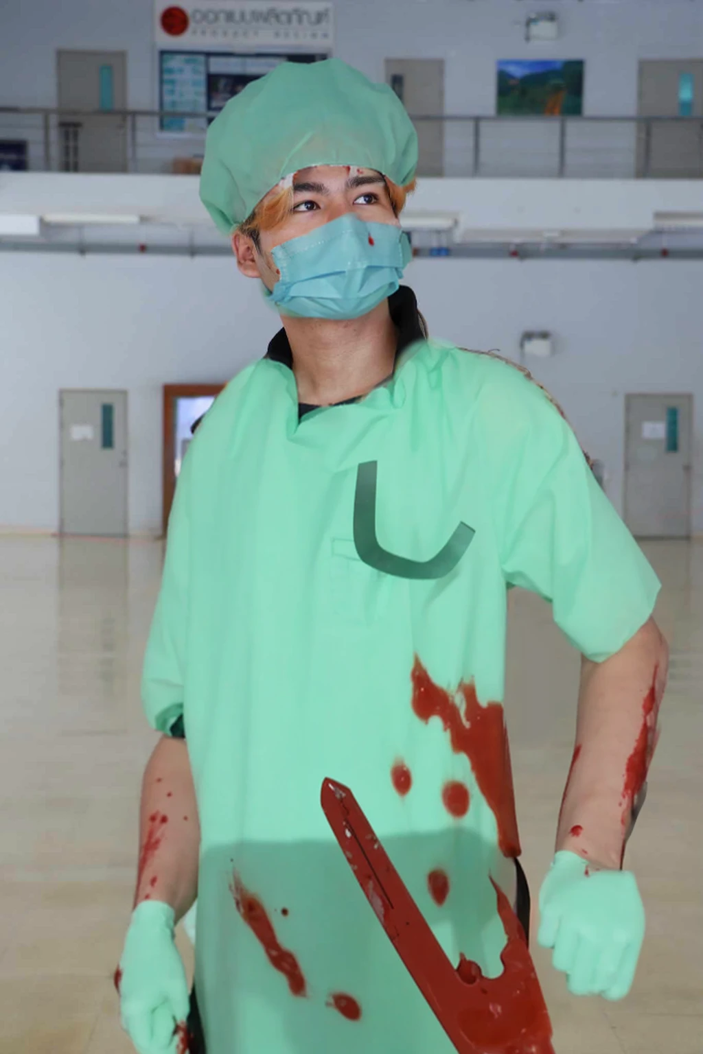 blood-stained surgical gown with visible splatters and smears of blood.
Surgical gloves, also covered in blood, with some tears and wear.
A surgical mask that has dark, ominous stains and possibly a sinister smile peeking from behind it. Holding a bloody scalpel or surgical saw in one hand, with blood dripping from the blade.
Other surgical tools like forceps or scissors can be tucked into the pockets of the gown, also stained with blood.
A headlamp or surgical cap with blood splatters for additional detail.