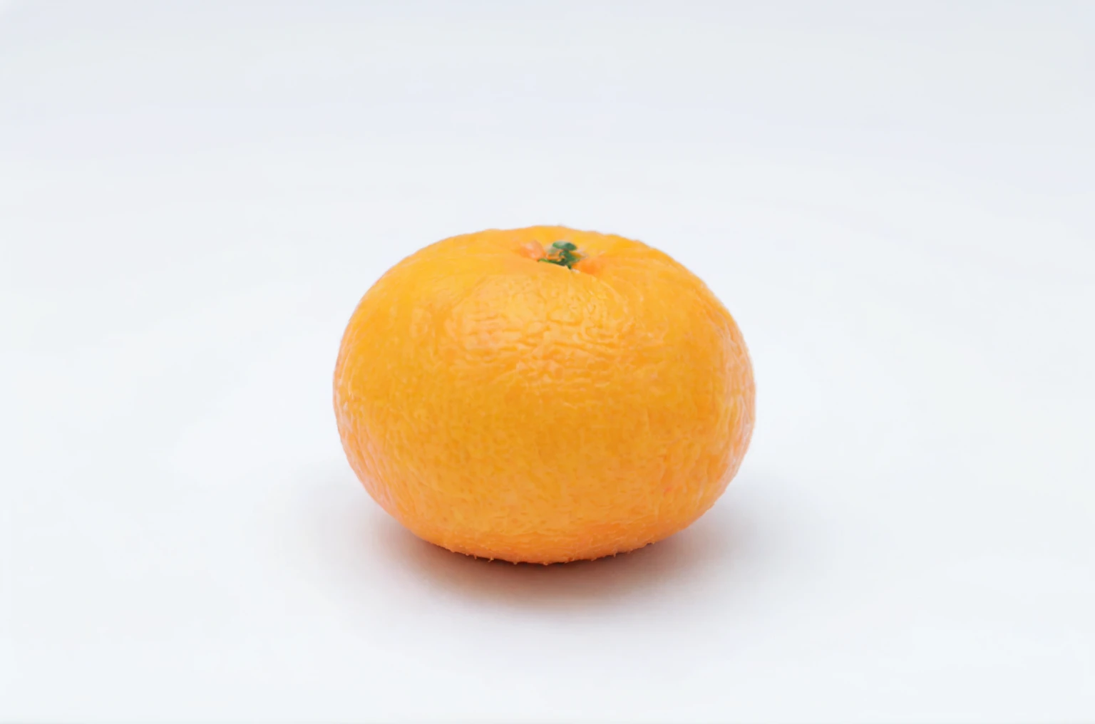 there is a single orange on a white surface with a white background, miniature product photo, orange head, orange body, an orange, oranges, orange subsurface scattering, high quality product photo, Highly detailed product photos, orange color, orange extremely coherent, orange skin, Professional Fruit Photography, orange, very orange, yellow-orange, fluffy orange skin, yellow orange
