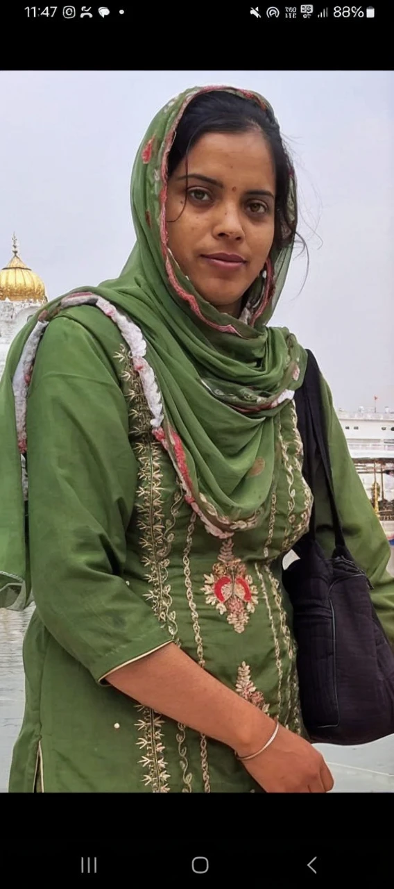 A beautiful grile ,india wear , Indian queen, beautiful eyes, neck pendant, a green kurta , brown shainy hairs, silky hair, green tree background, sony , canon, f.1.4, nikon bokhe , blur , futuristic, realistic, daylight,realface