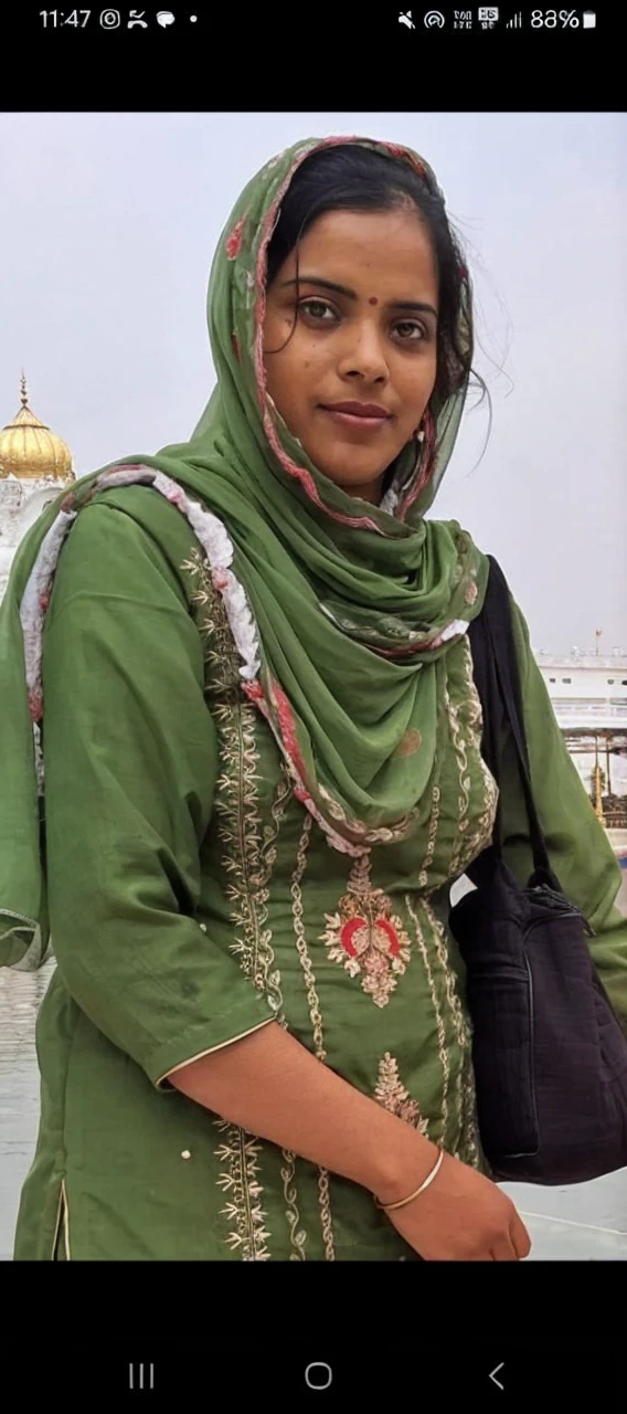 A simple, cute Indian girl wearing a traditional salwar suit. She has a warm smile and a gentle demeanor, exuding a natural charm. Her salwar suit is adorned with subtle, elegant patterns, reflecting her modest yet graceful style. The vibrant colors of her outfit complement her complexion, and face makeup lite no required bindi and her hair is neatly styled, enhancing her overall appearance HDR.