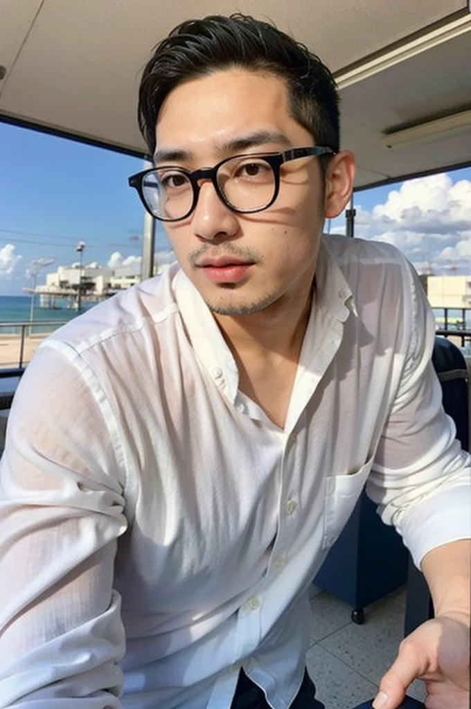 A young Asian man with glasses and large muscles looks at the camera. In a white button-down shirt , seaside beach sunlight looking at the airport