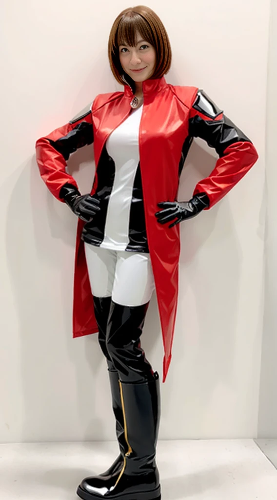 A woman in a red and black Sentai hero suit stands upright against a white wall. The suit is made of a shiny material, and she is wearing white gloves and yellow-red boots. The woman has short, shoulder-length hair and a natural look on her face.