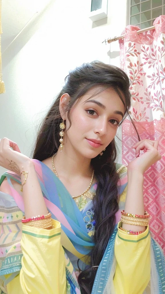 A woman with wavy, shoulder-length hair and neutral makeup poses against a plain background, wearing a light green floral lehenga with a deep neckline and a matching sheer dupatta adorned with gold embroidery. She accessorizes with a statement necklace.