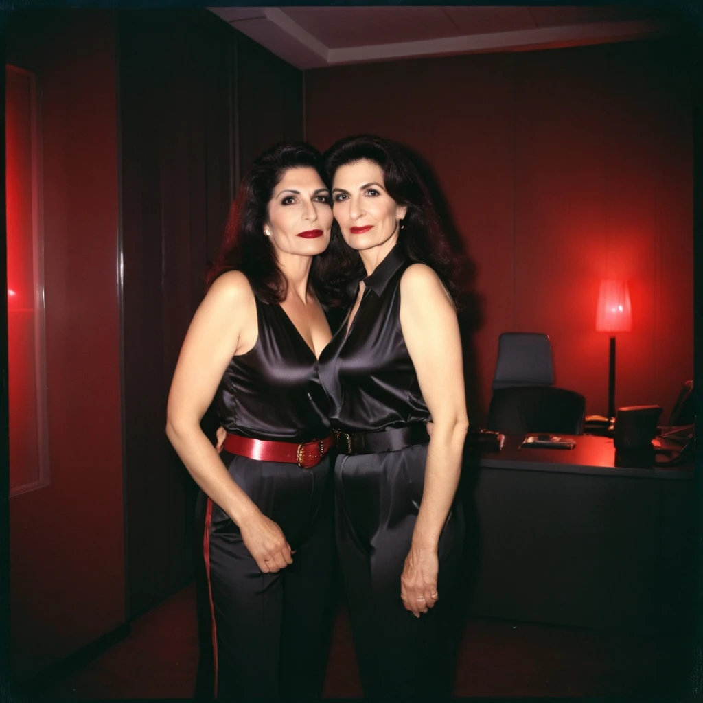 AnalogRedmAF Polaroid, two busty Assyrian mature women, Silk sleeveless tight Blouse - tucked into Black Satin Belted Flared Pants - Kissing each other, Dimly Lit, Red Spotlight lighting, liminal empty Office room, Looking at Camera, Nighttime, blurry and hazy background.