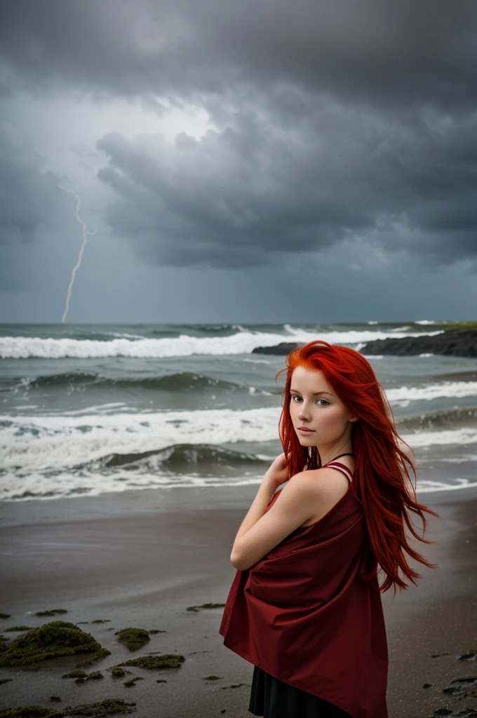 Red-haired girl on the seashore in a storm