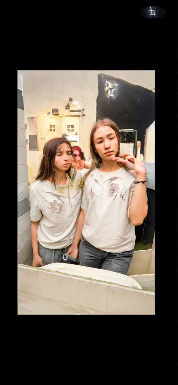 three very thin young nude teenager who looks anorexic gazing sadly into the camera lens. Moaning face. the girl's body is similar to that of a pubescent.with a crucifix around his neck. They are taking a shower.