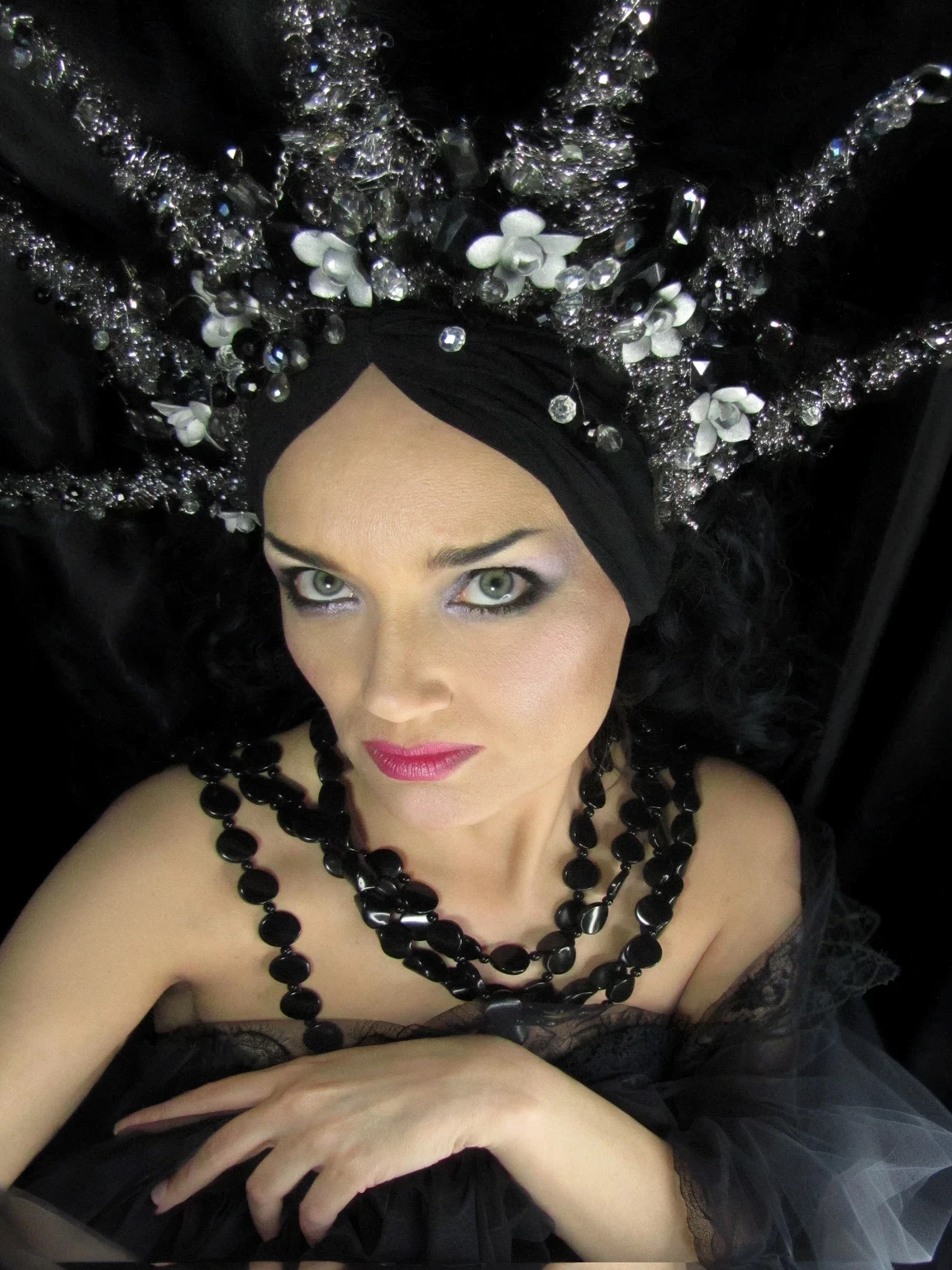 dslr hdr proffesional photo, arafed woman, background is a satin black fabric curtain, inspired by Ursula Wood