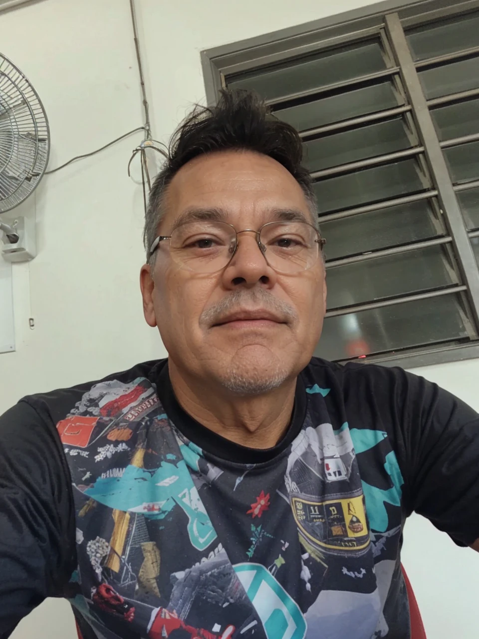 The face of a 60-year-old gray-haired man with glasses,for a YouTube profile 