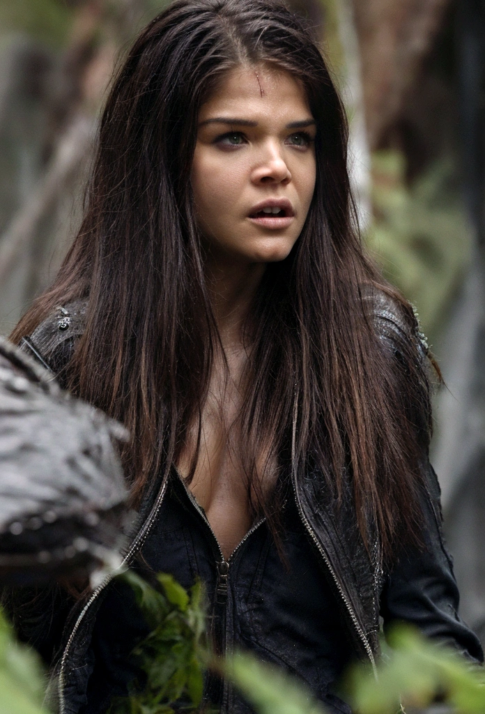 Marie Avgeropoulos  walking in the rain on a very rainy day, strong wind, big breasts, with little clothing, view from below, camera from afar, detailed image, high quality, oppai