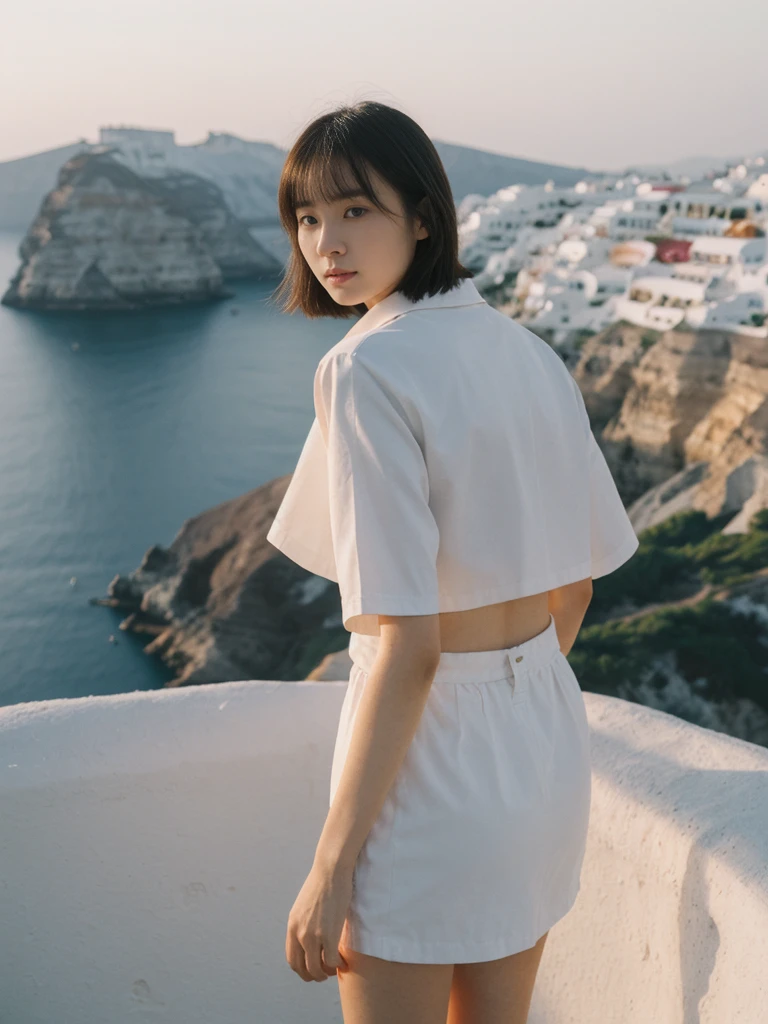 her name is Asako, high quality, 1girl, ((20-year-old fit Caucasian woman)), ((20 years old)), ((slim)), ((Korean Short Bob)), pose: standing, wearing Contemporary Generation-Z modern wear different colored, BACKGROUND: "Watching the sunset and then the stars from the cliffs of Oia, with the white-washed buildings glowing softly."