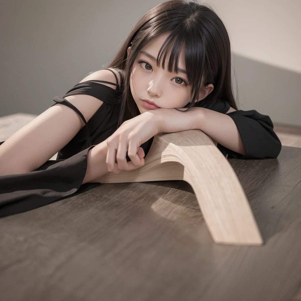 Girl in black lying on the table