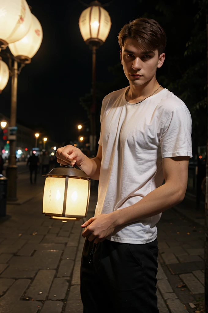 a man of Slavic appearance, 24 years old, on the street in the evening under the light of lanterns in the city in a white T-shirt