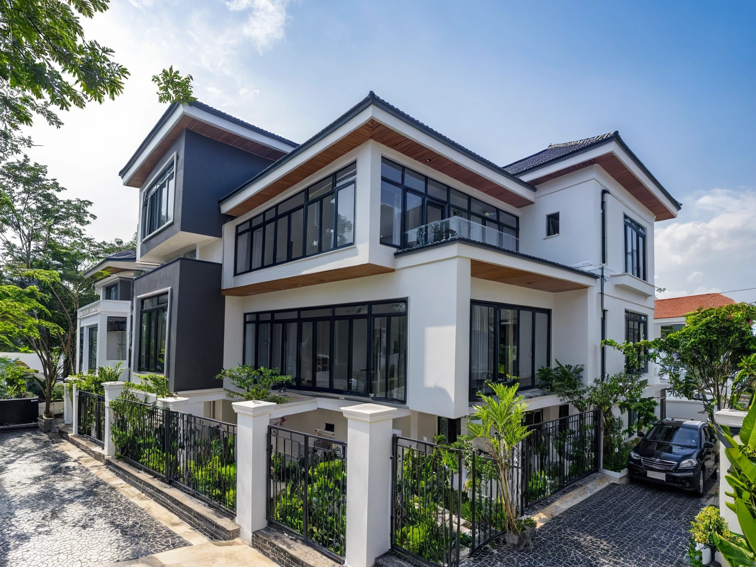 (masterpiece:1.2), best quality, photo of A two-story modern house in VietNam with white walls and dark tiles on the roof., tree and plant environment,daylight, streetcapes, natural light, vivid color, The exterior of an elegant single family home features large windows, a dark gray door frame.