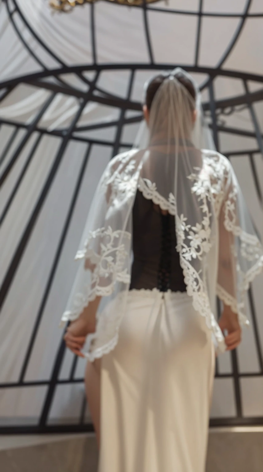 Back view, wearing lace and a full white veil, bare and large breasts, full lace