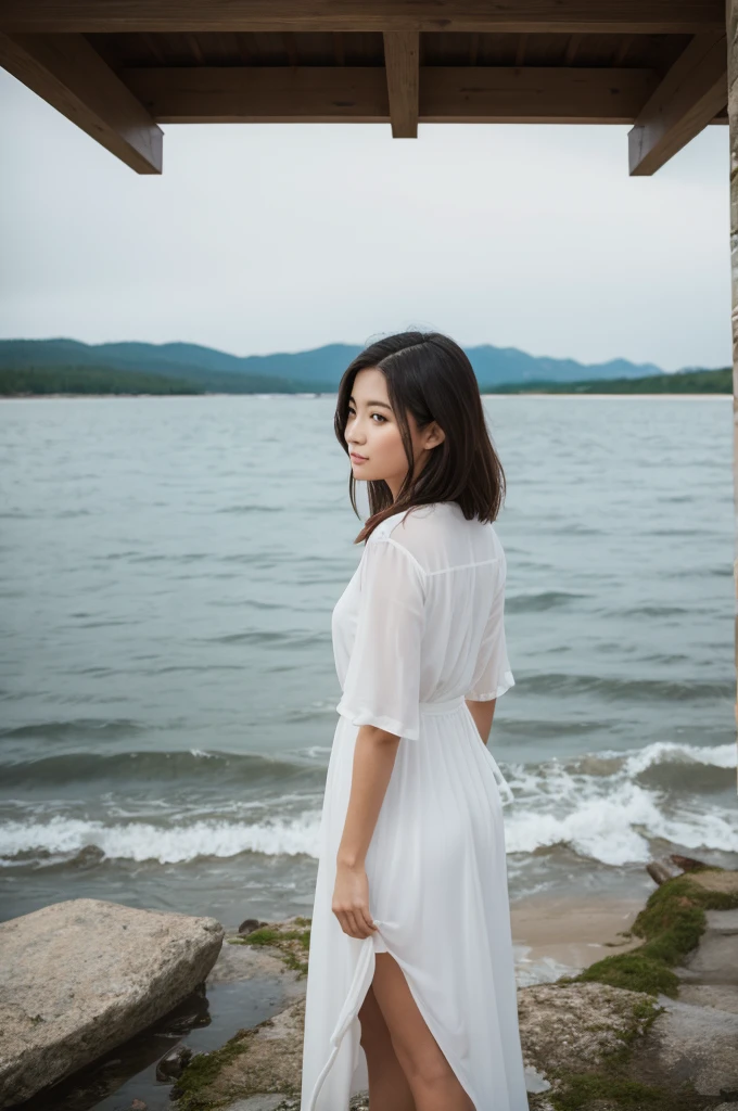 Woman standing by the water