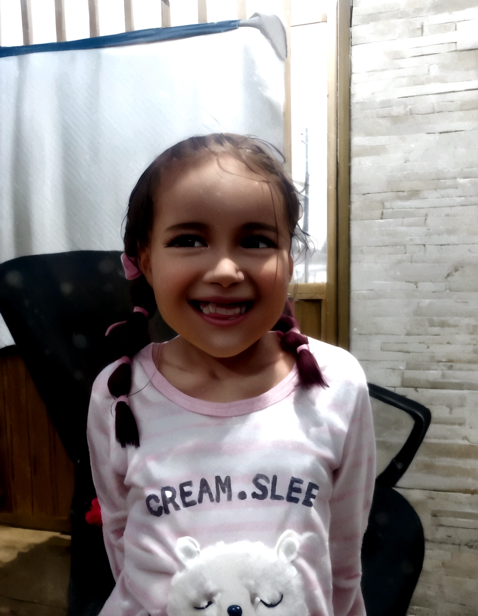 4 year old , with braid hairstyle, cute and kind smile, wearing pink pajamas with white details